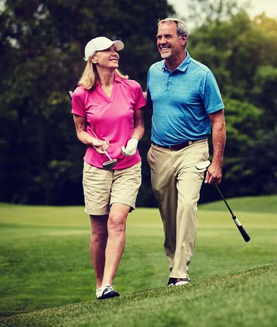 couple golfing
