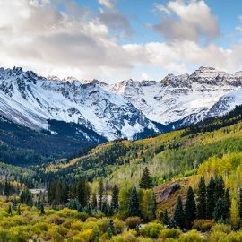 A beautiful snowy mountain range and valley deep within the heart of Colorado.