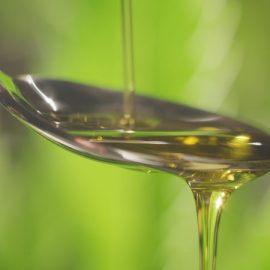 cbd oil drizzling on a spoon