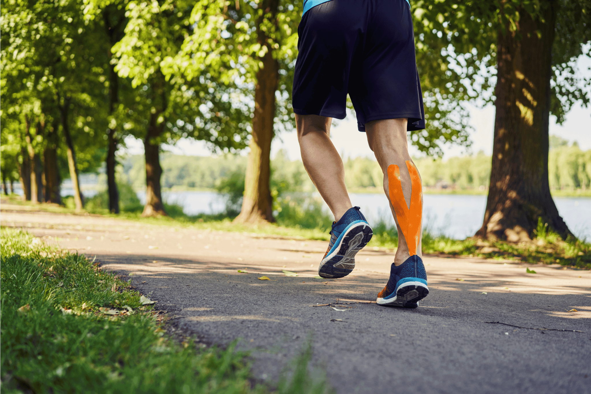 man running with k tape on calf