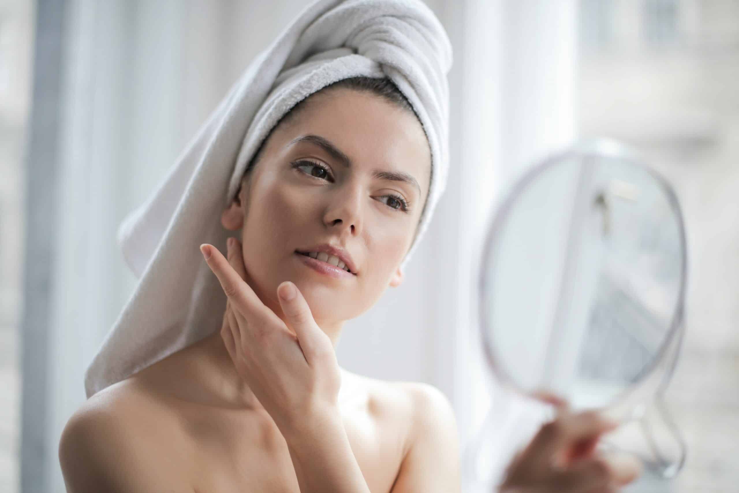 woman applying face creme